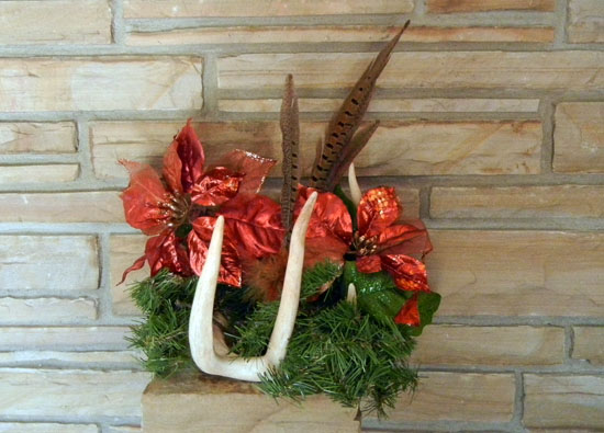 antler arrangements for the mantel with pheasant feathers